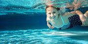Girl swimming at Waves Leisure Pool, Torquay