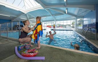 Fun in the indoor swimming pool at South Bay Holiday Park, Brixham, Devon
