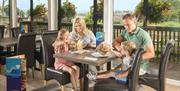 Family eating at South Bay Holiday Park in Brixham, Devon