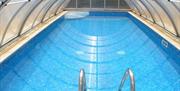 Covered heated pool.  Atlantis Holiday Apartments, Torquay, Devon